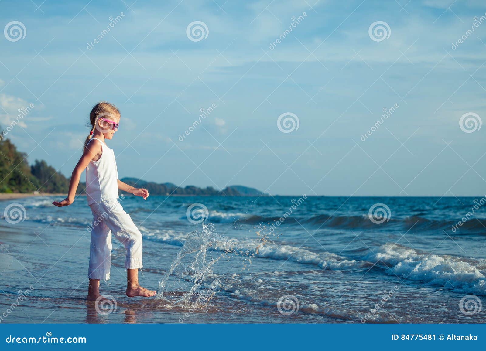 Little Girl Dancing on the Beach at the Day Time. Stock Image - Image ...