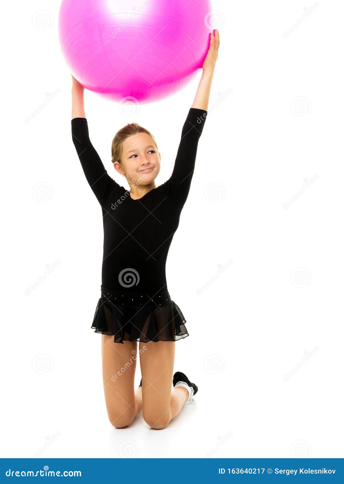 Little Girl Doing Exercises on a Big Ball for Fitness. Stock Image ...