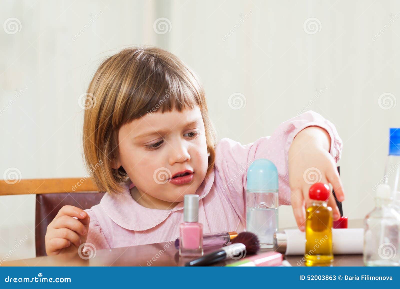 Little girl doing makeup stock image. Image of female 52003863