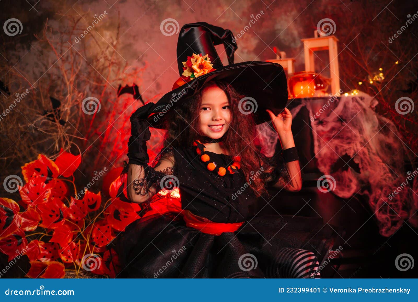 Little Girl Dressed As a Sidin Witch on a Gloomy Background. Prepare ...