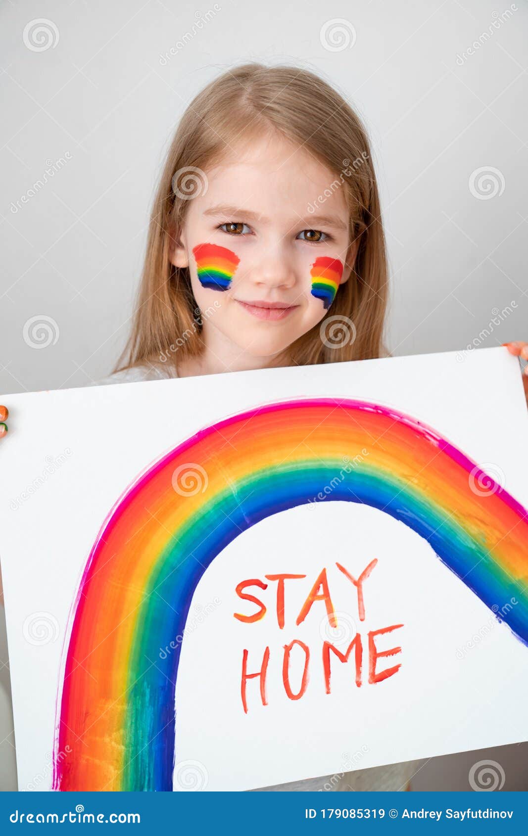 little girl drew rainbow and poster stay home.