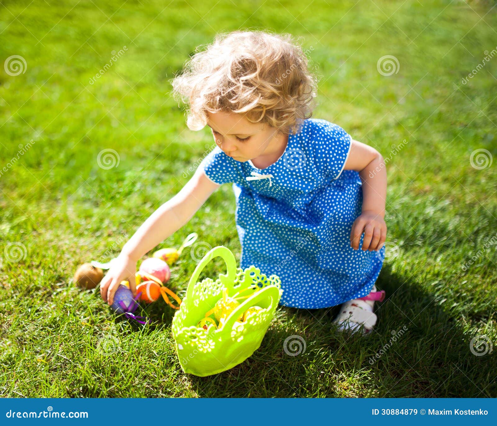 little girl on an easter egg hunt
