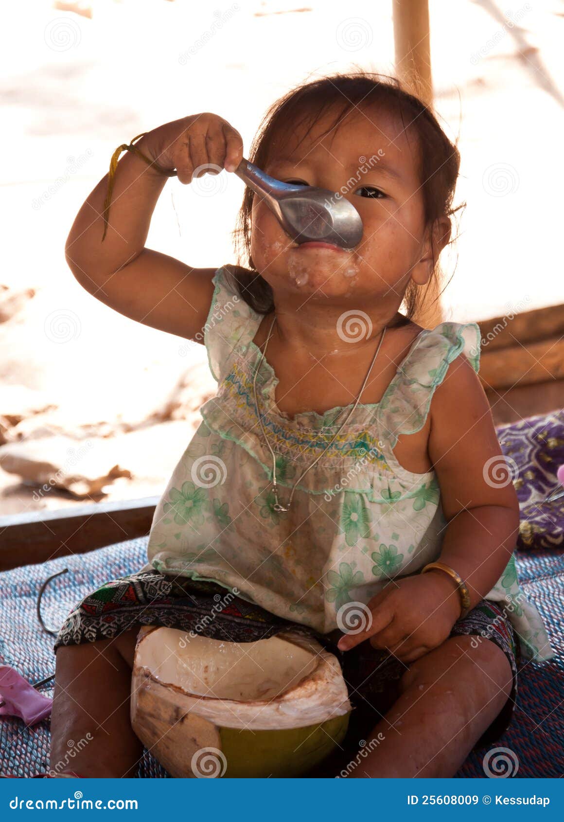 Little girl eat coconut editorial stock image. Image of young 25608009