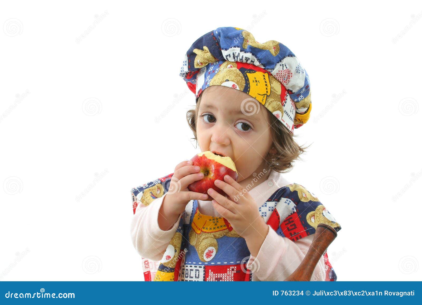 Little Girl Eating an Apple Dressed As a Chef Stock Photo - Image of ...