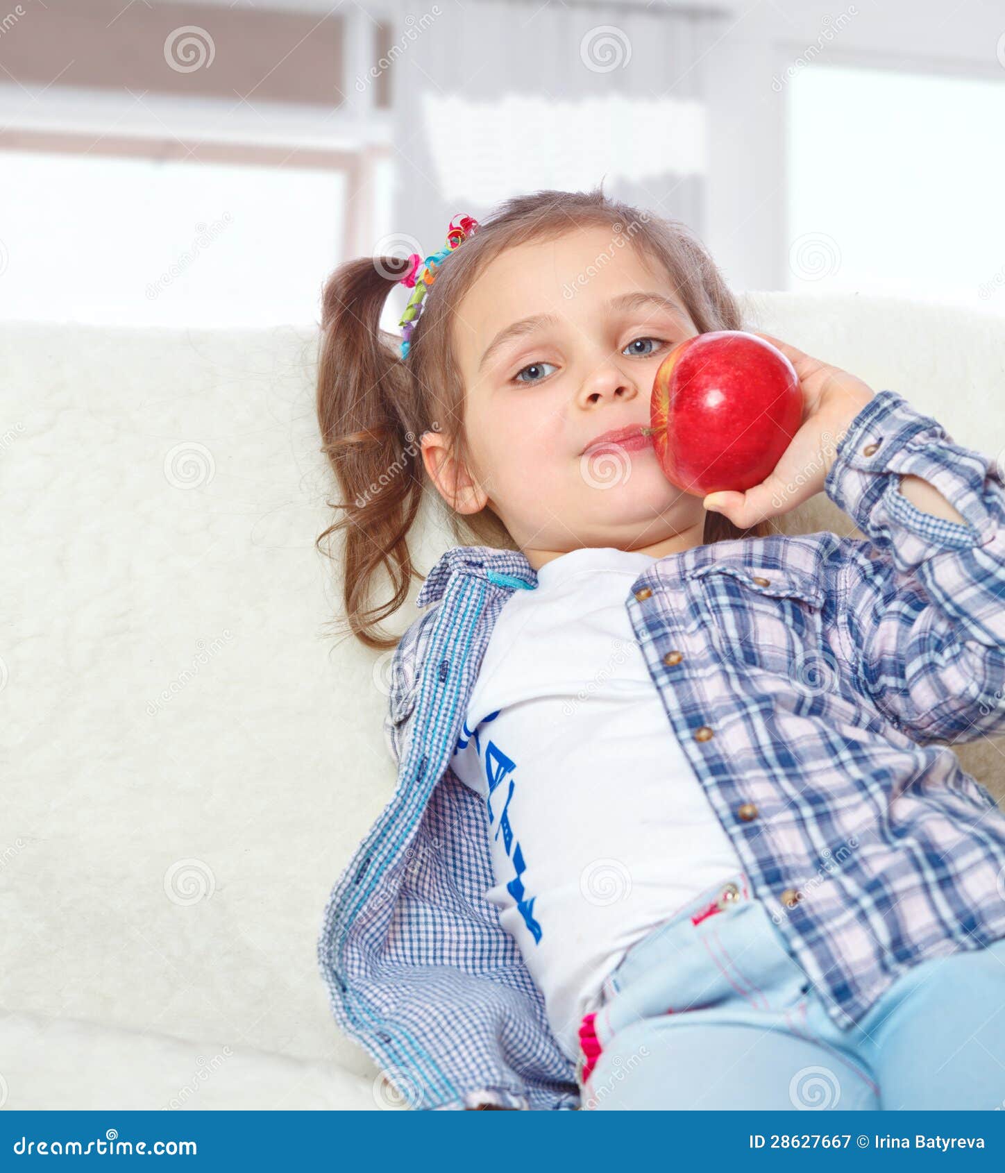 Little girl eating apples stock image. Image of child 28627667