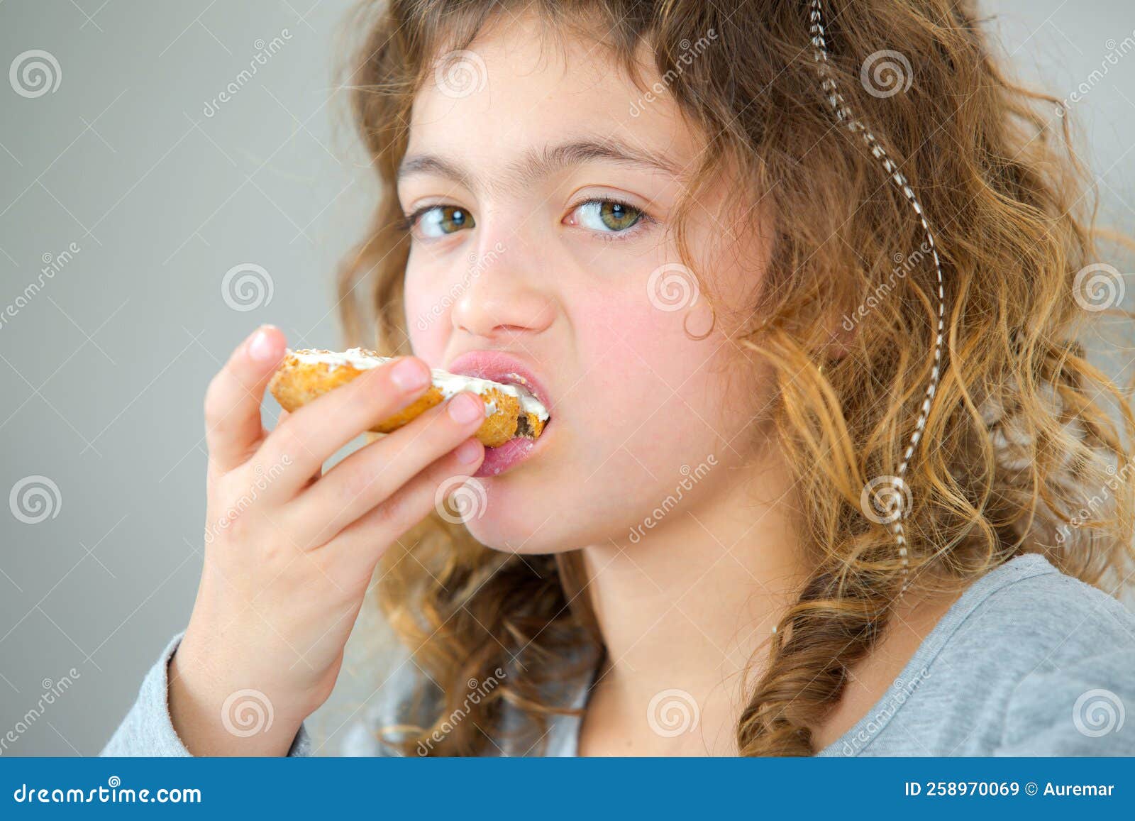 Little girl eating bread stock image. Image of bread 258970069