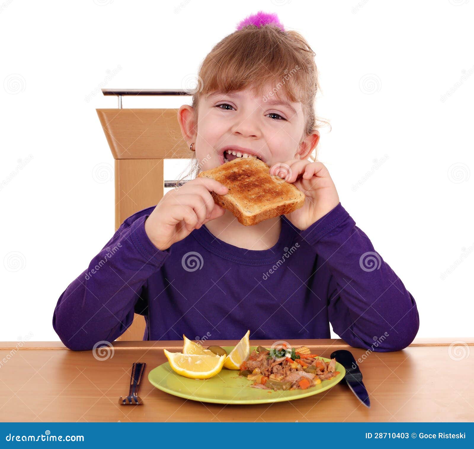 Little girl eating bread stock image. Image of girl, delicatessen