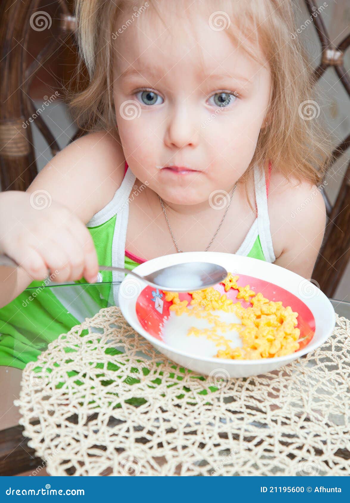 Little girl eating cereal stock photo. Image of milk 21195600