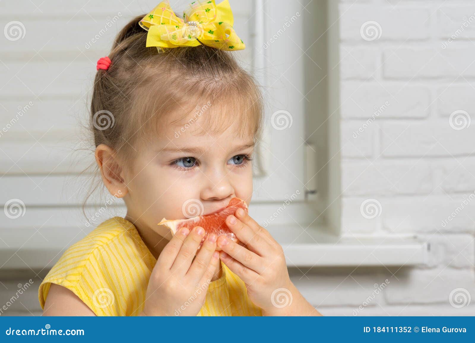Little Girl Eating Grapefruit Stock Photo Image of cheerful, fresh