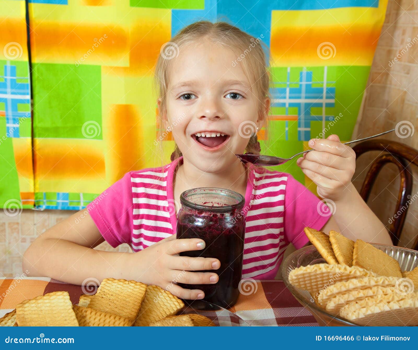 Little girl eating jam stock photo. Image of berry, patisserie 16696466