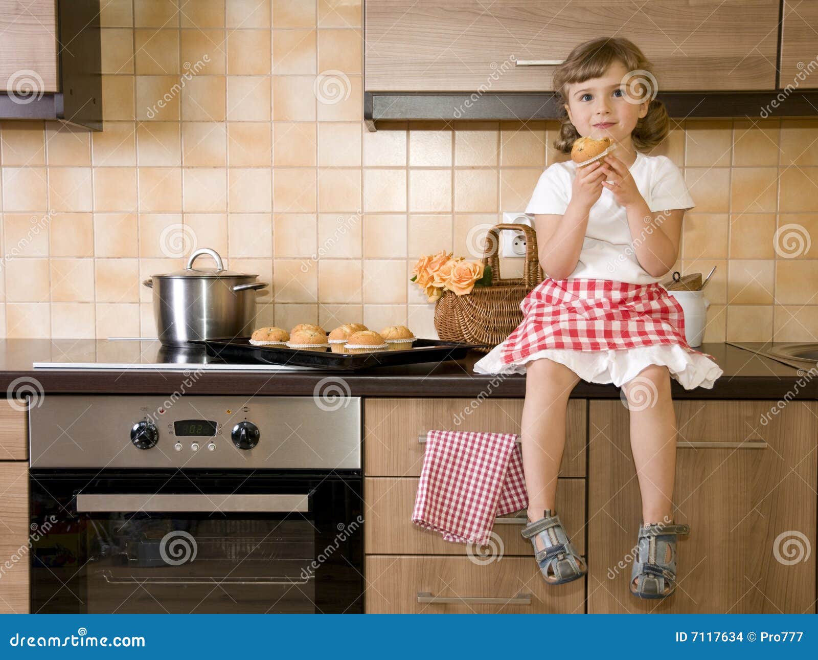 Little girl eating muffin stock photo. Image of little 7117634