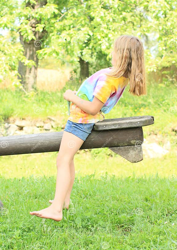 Little Girl Exercising on a Swing Stock Photo - Image of barefeet ...