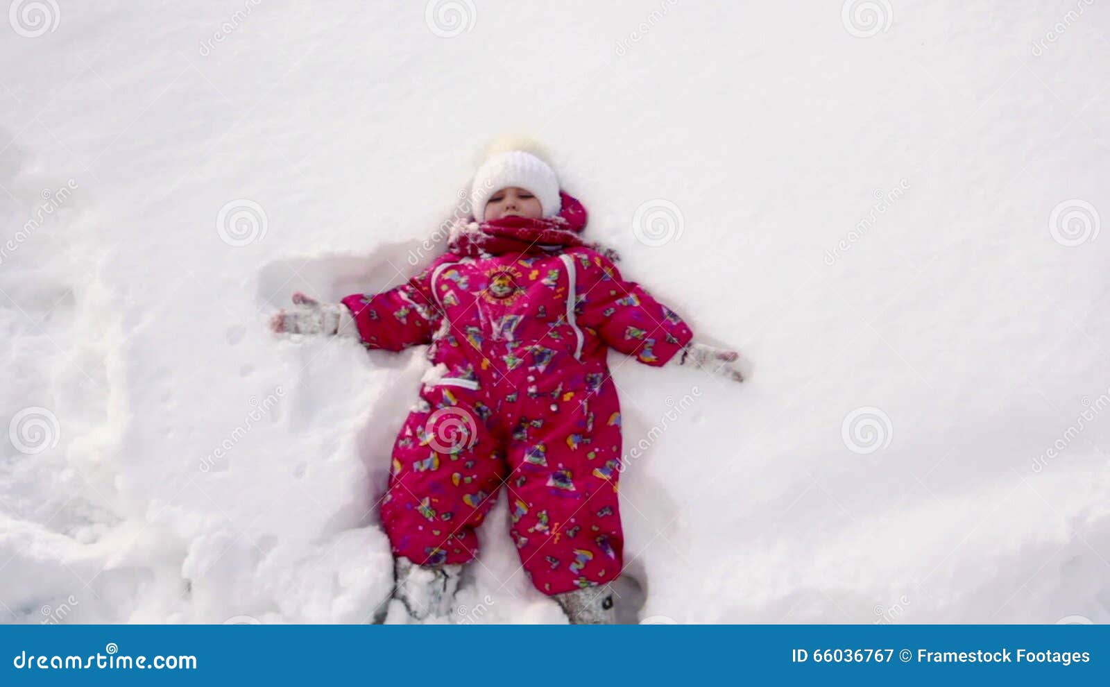 The Little Girl Falls on Snow and Laughs Stock Video Video of girl
