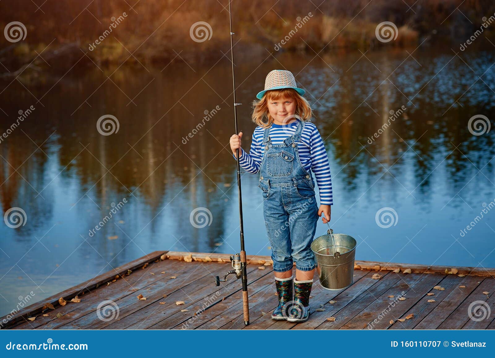 Little Girl Fisherman with a Fishing Rod and a Bucket of Fish on a Wooden  Pier Stock Image - Image of person, water: 160110707