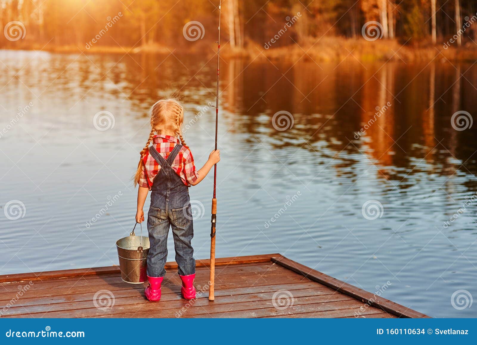 Little Girl with a Fishing Rod and a Bucket Came Fishing and Looks at the  Pond. Back View Stock Photo - Image of bucket, outdoor: 160110634