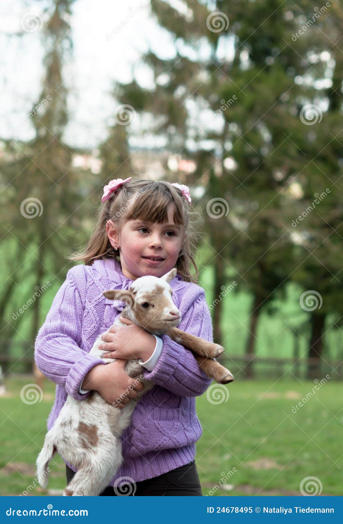 Little girl with a goat stock image. Image of color, child 24678495