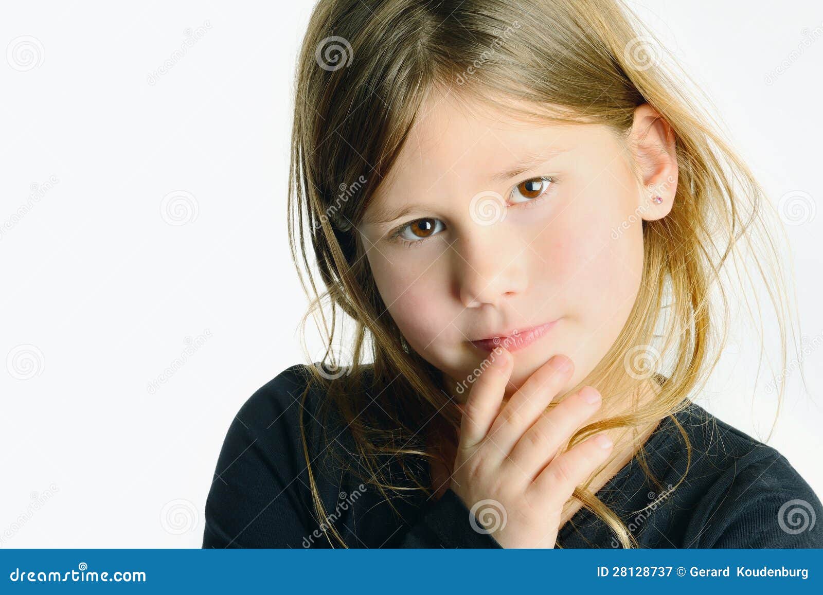 little girl with closed hands at face little girl with closed hands at face