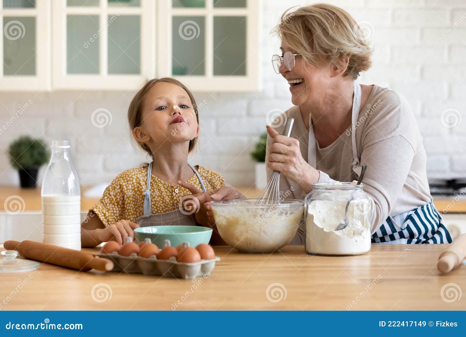 https://thumbs.dreamstime.com/z/little-girl-having-fun-cooking-granny-kitchen-playful-small-cute-preschool-kid-dough-caring-loving-elderly-mature-222417149.jpg