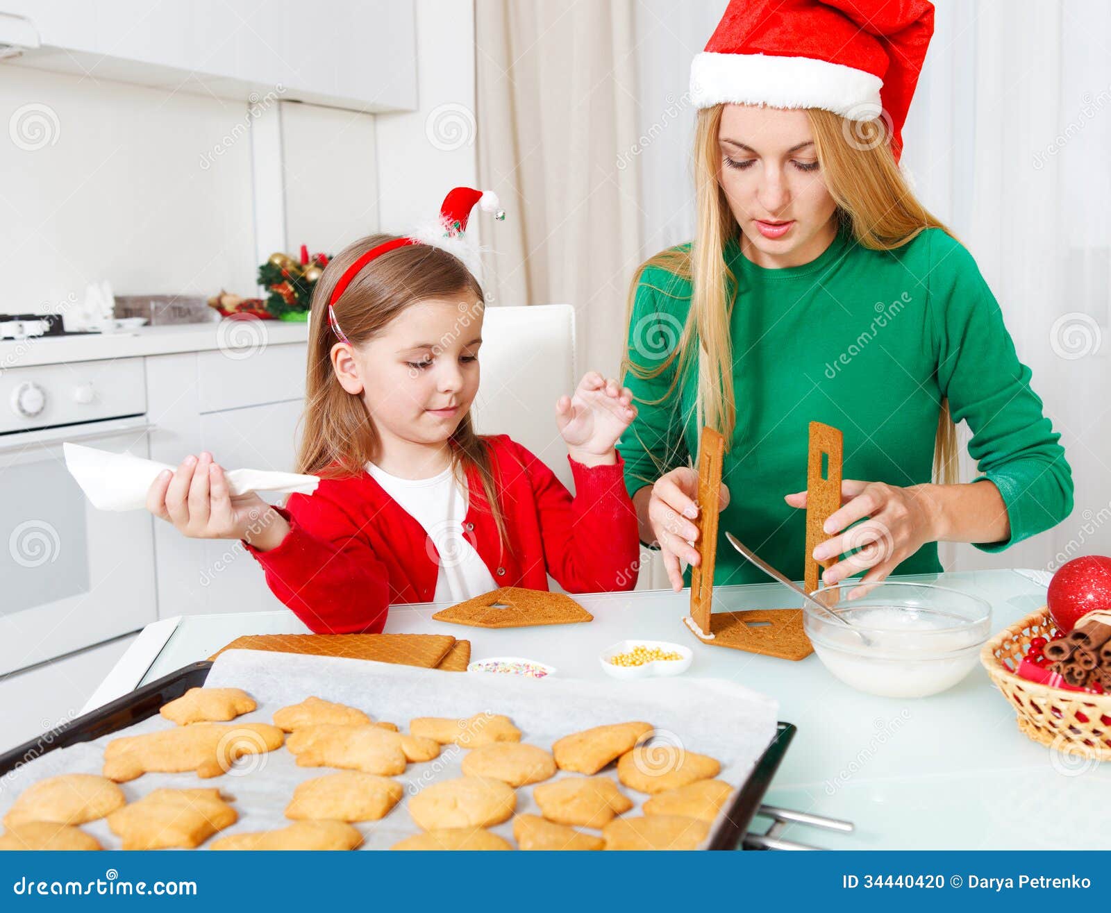 Little Girl With Her Mother Baking Christmas Cookies Stock 