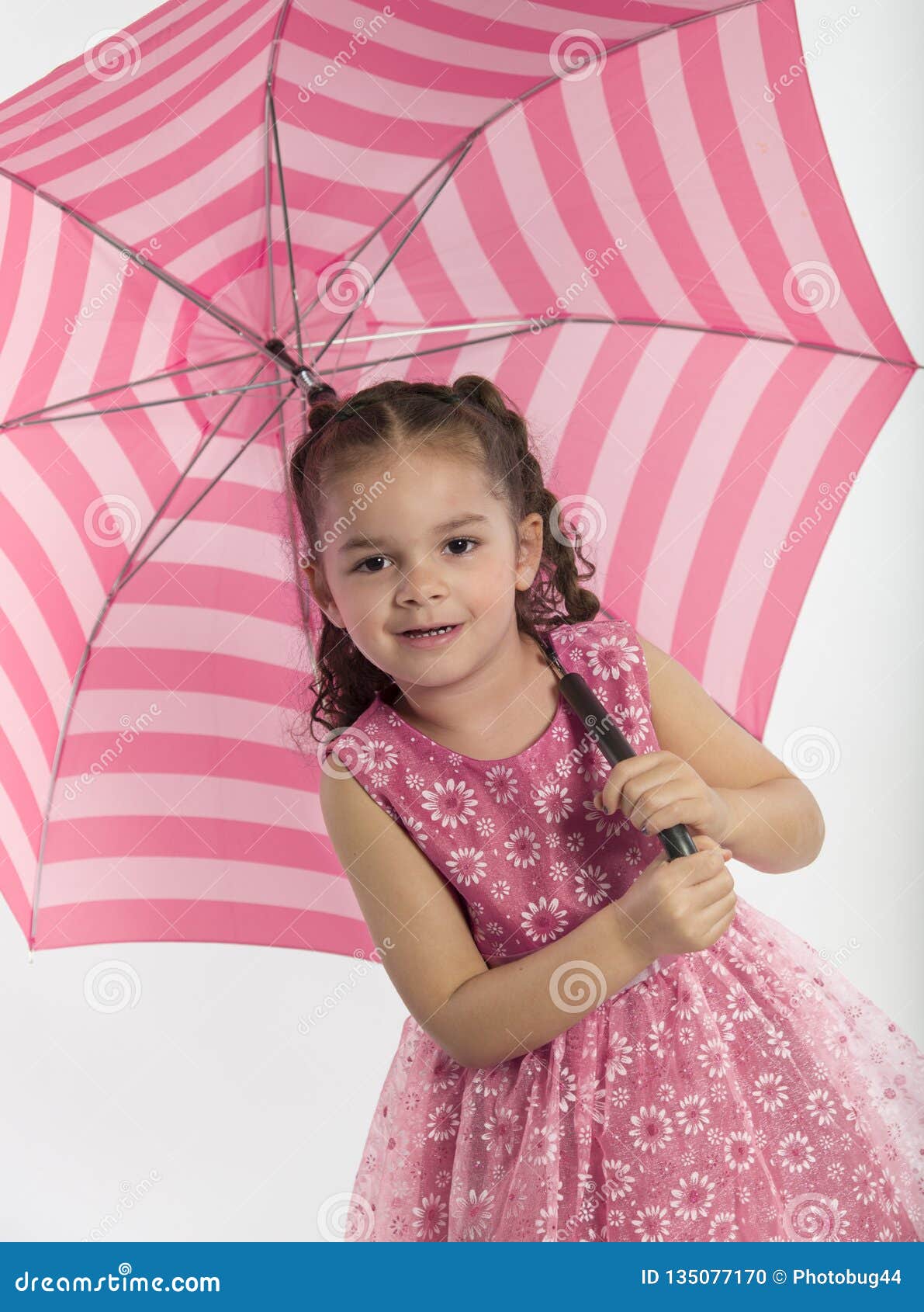 Little Girl Holding Big, Striped Umbrella Stock Photo - Image of happy ...