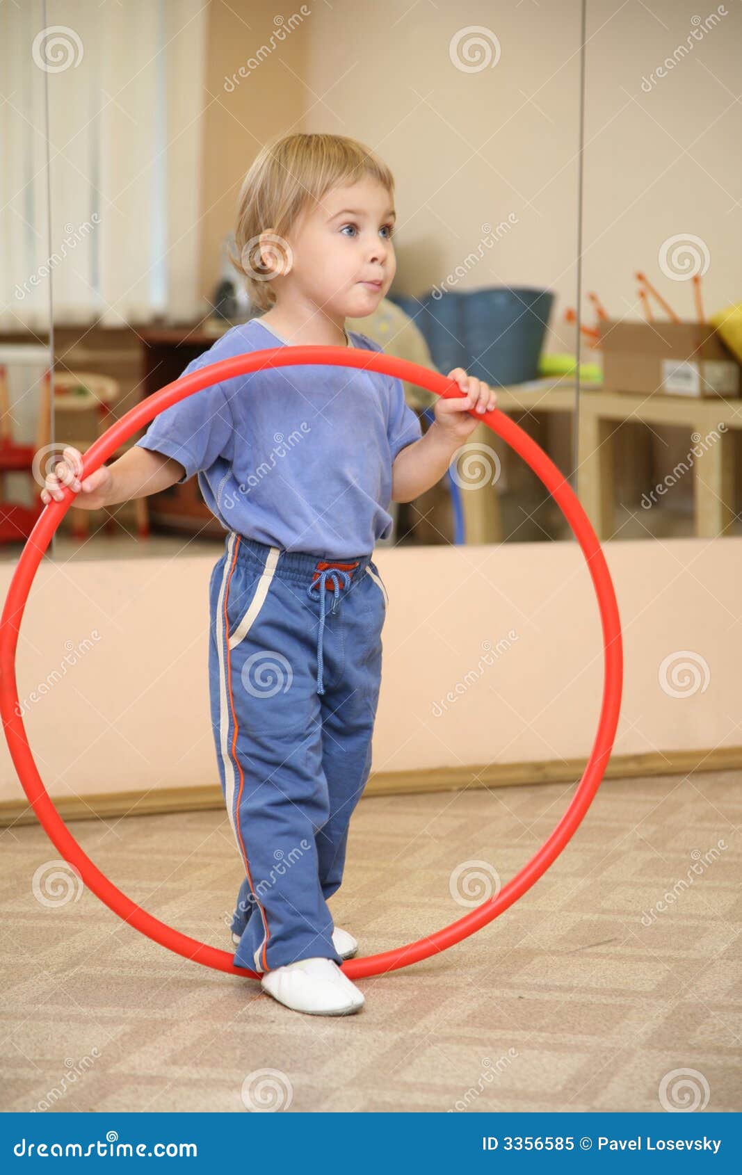 Little girl and hoop stock image. Image of female, safety 3356585