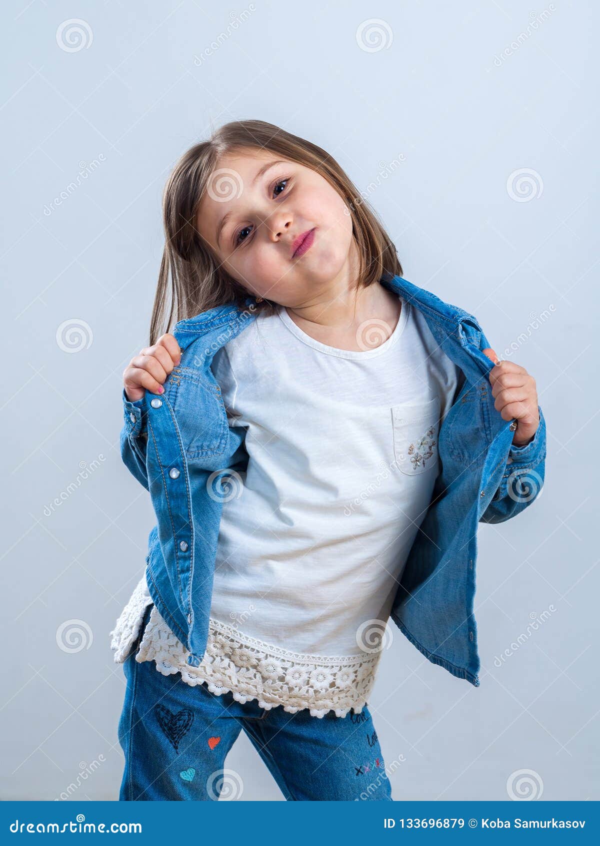 Little Girl in Jeans Posing for the Camera in the Studio Stock Image Image of model, childhood