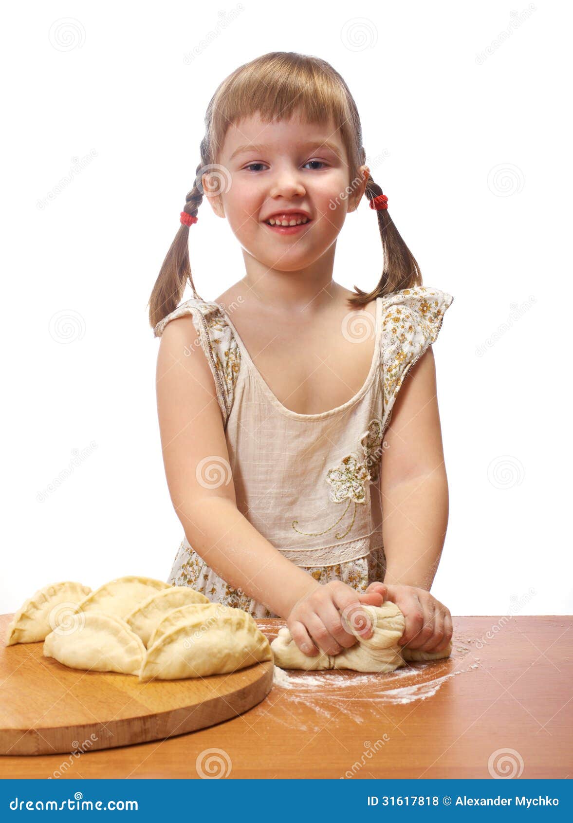 Smiling little girl kneading dough at kitchen with baking a pie. isolated on white