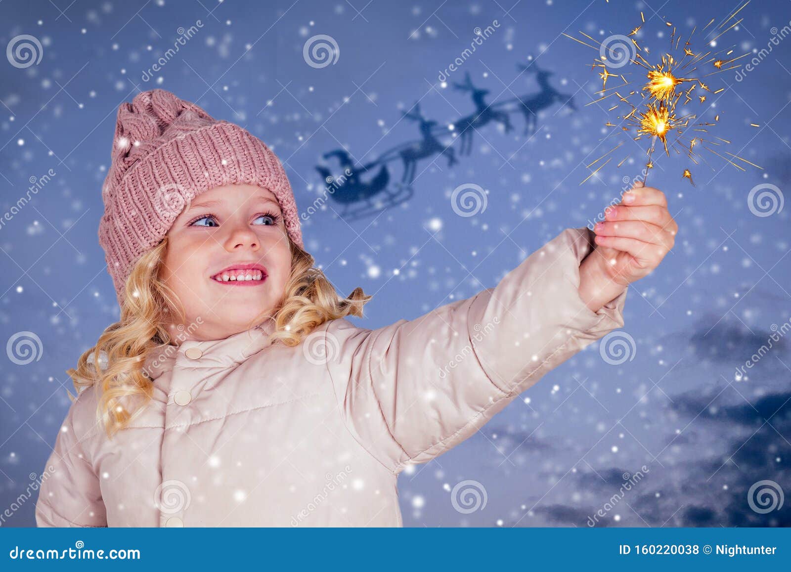 Little Girl in a Knitted Hat Holding Fireworks on Darkblue Background ...