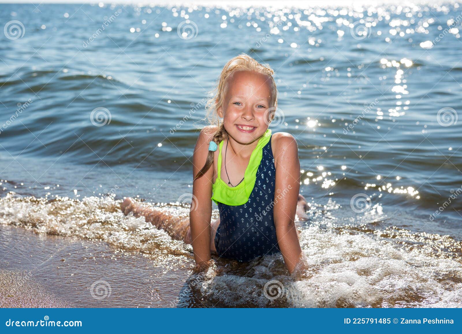 Little Girl is Laughing and Swimming at Sea on a Sunny Day Stock Image ...