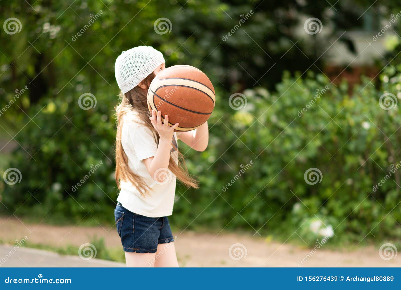 Little Girl With Long Hair Playing Basketball. Stock Image ...