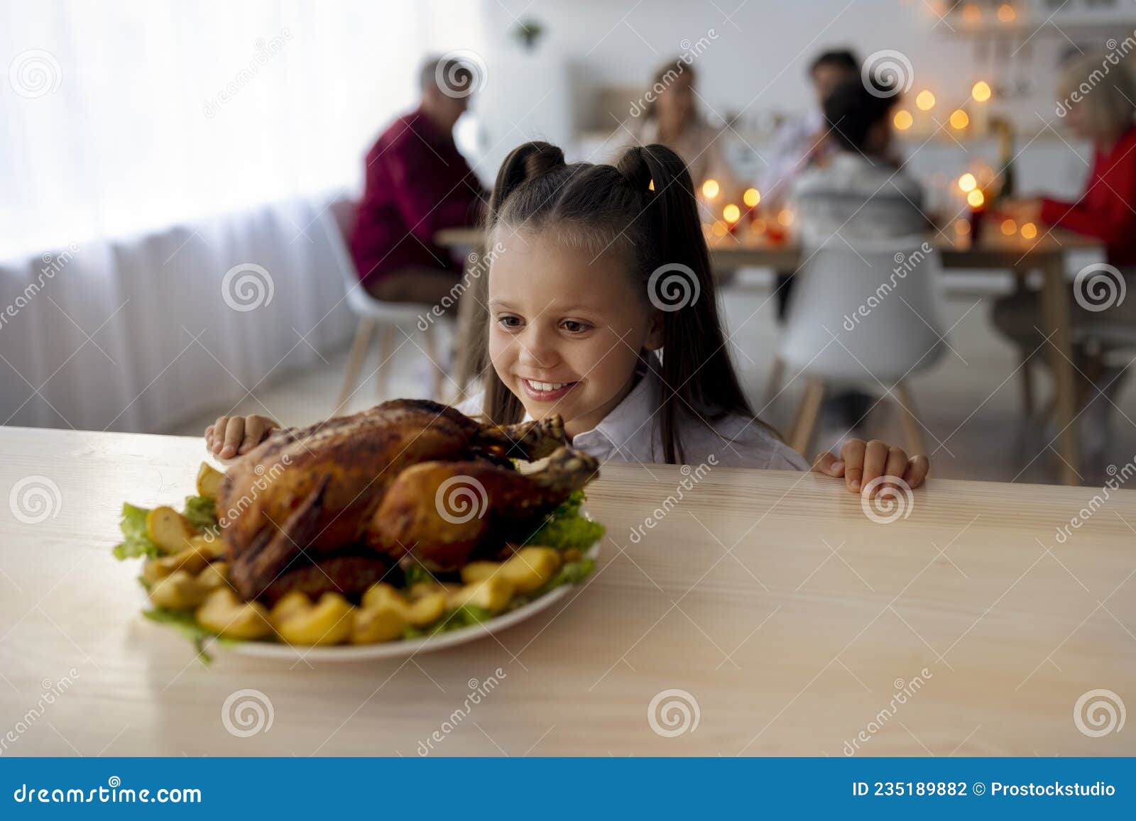 Little Girl Looking at Thanksgiving or Christmas Turkey, Waiting for ...