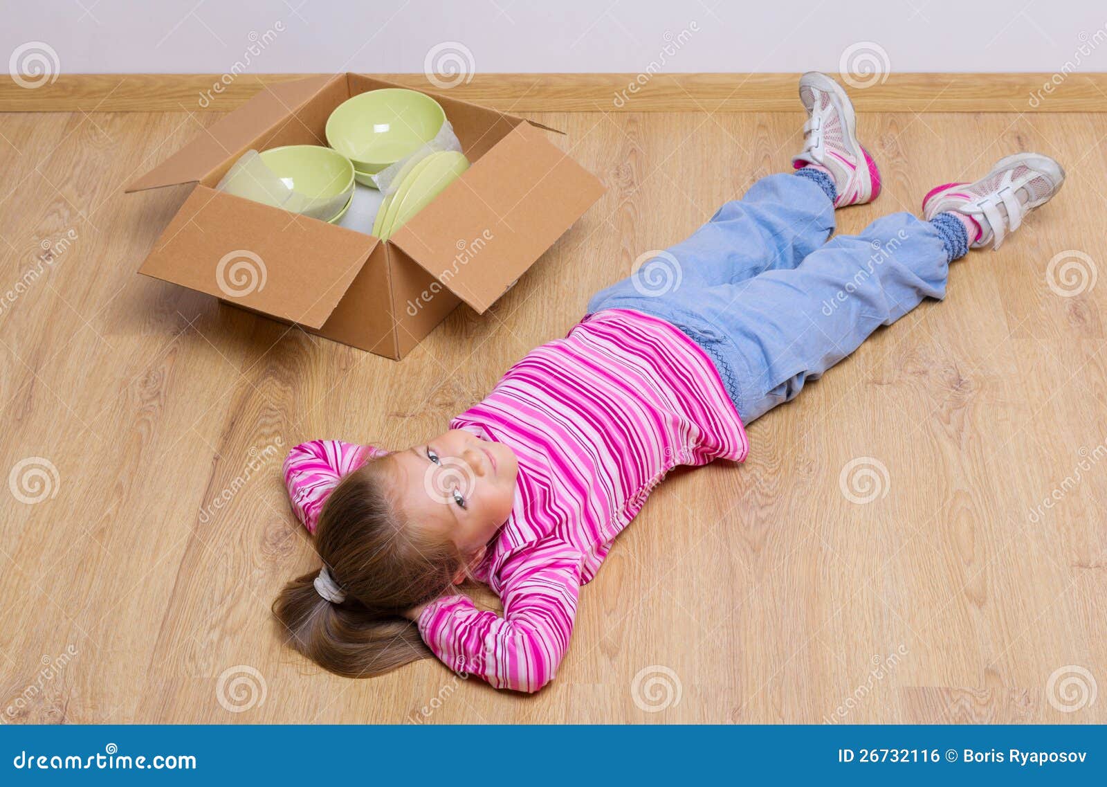 Little Girl Lying On The Floor Stock Photo Image of moving, decoration 26732116