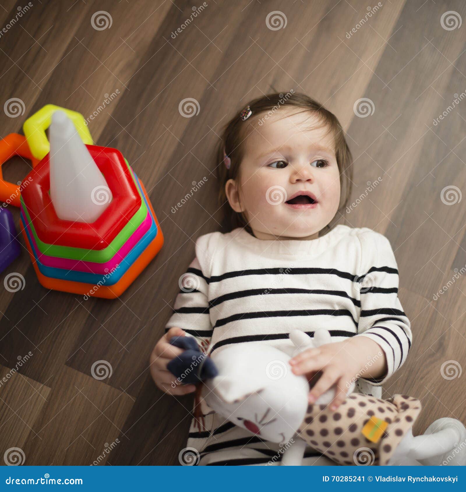 Little Girl Lying on the Floor and Laughs Stock Image Image of