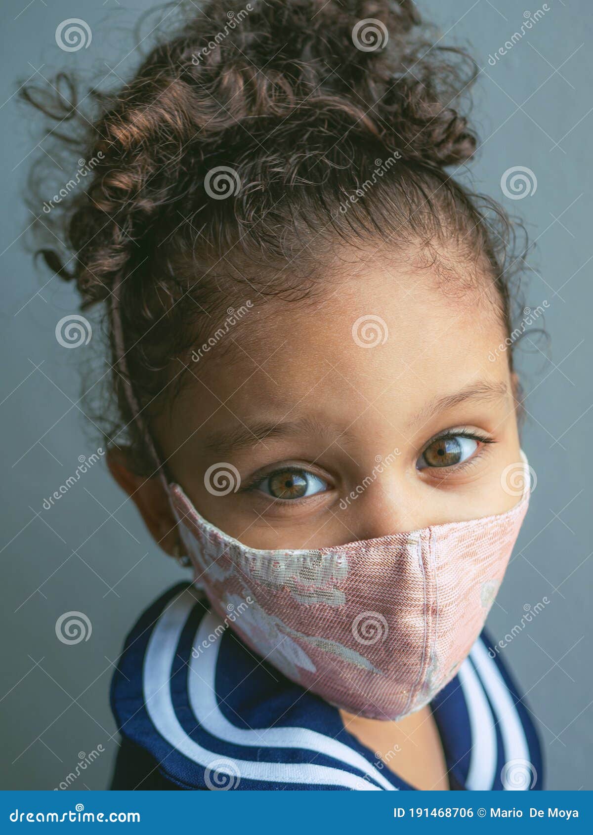 A little girl with a mask stock photo. Image of little 191468706
