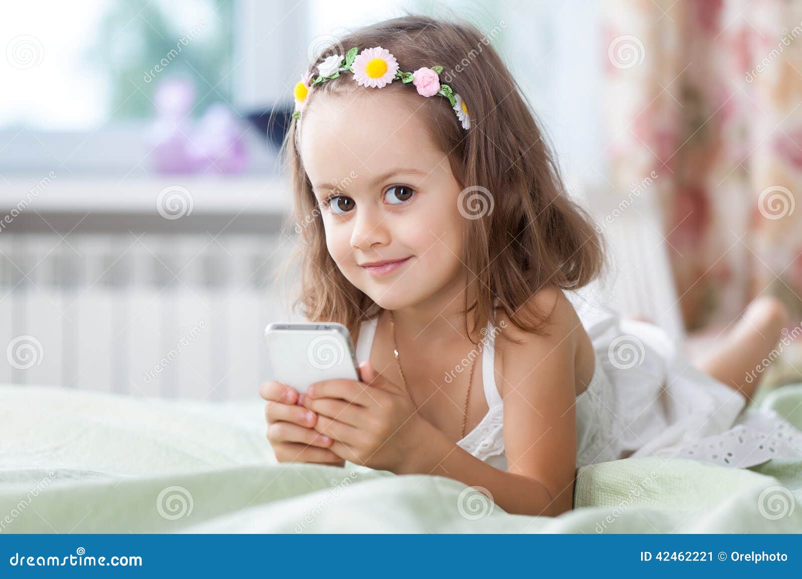 Little Girl with Mobile Phone in Her Hands Stock Image Image of
