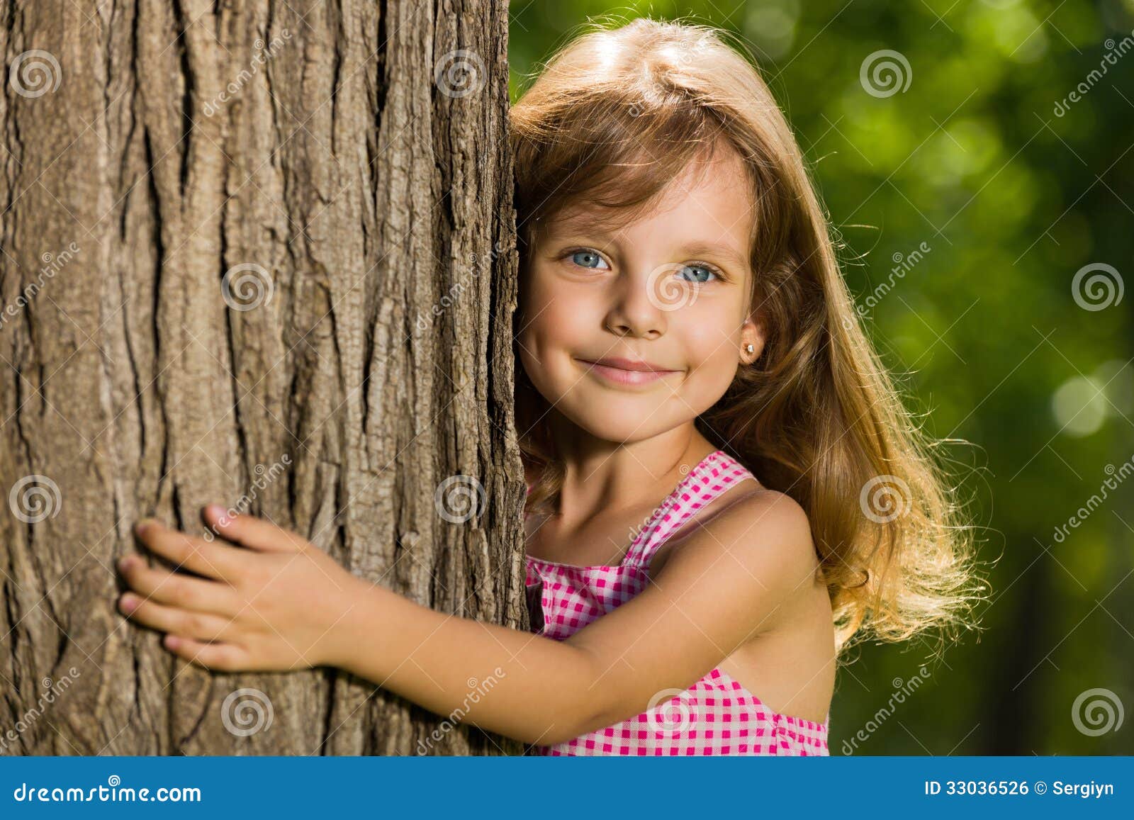 Little girl near a tree stock photo. Image of childhood 33036526