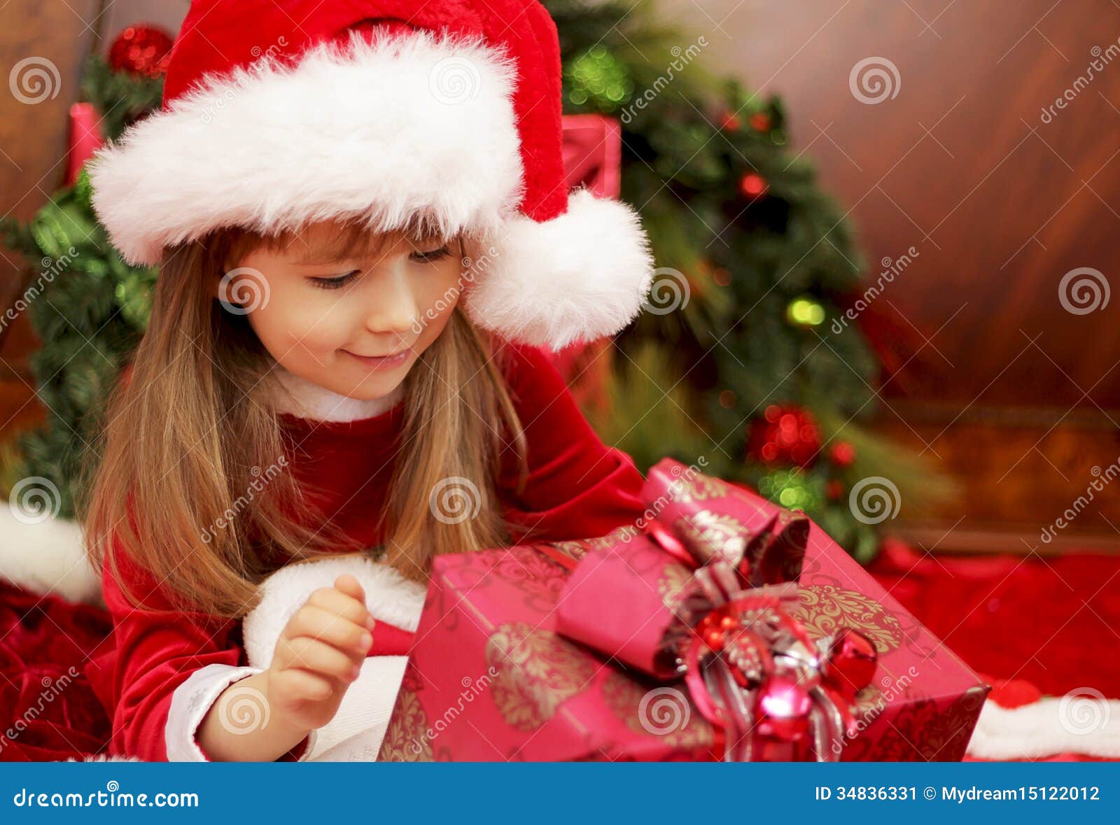girl opening christmas presents