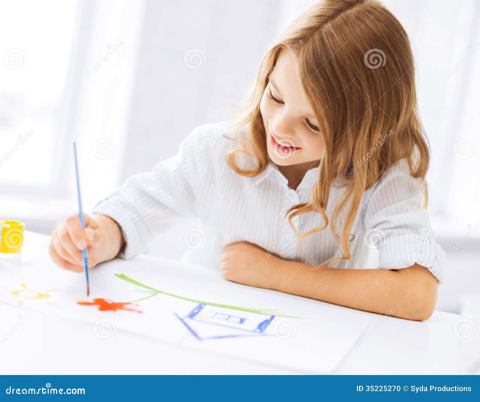 Little girl painting picture. Education, school, art and painitng concept - little student girl painting picture