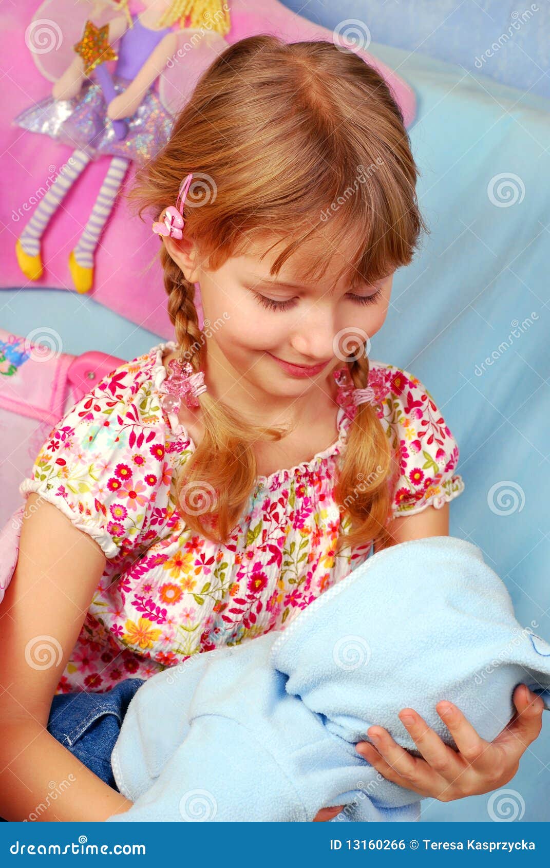 little girls playing with baby dolls