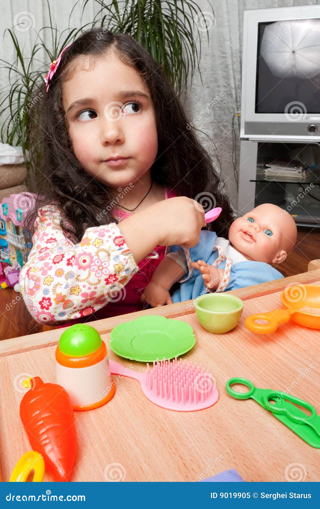 Little Girl Playing With Doll Stock Image - Image: 9019905