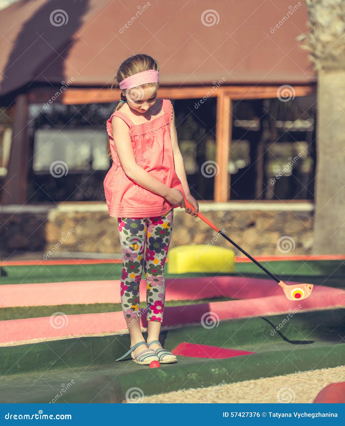 Little girl playing golf stock photo. Image of little 57427376