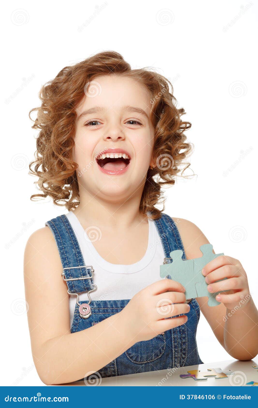 Little Girl Playing in the Puzzle. Stock Photo Image of childhood