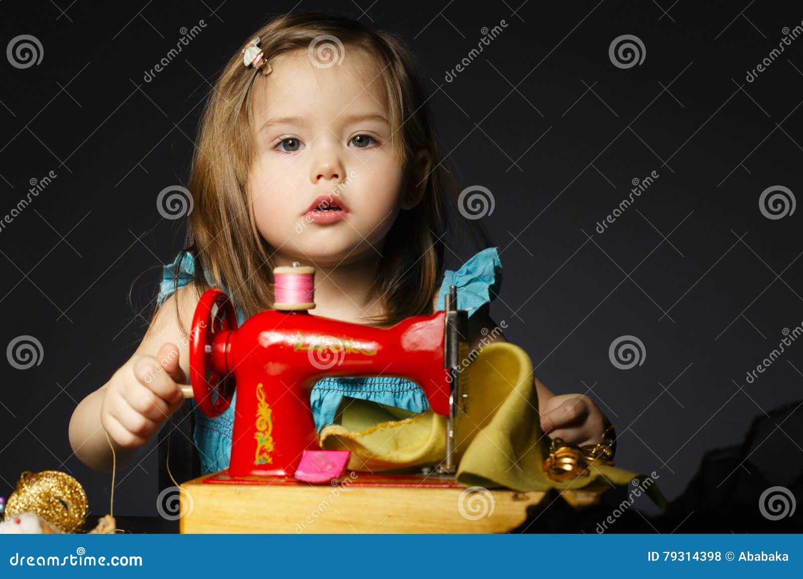 Little Girl is Playing with Sewing Machine Stock Photo Image of