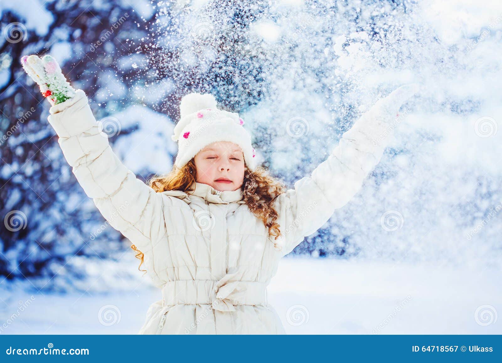 Little Girl Playing with Snow. Falling Snow Around the Child Stock ...