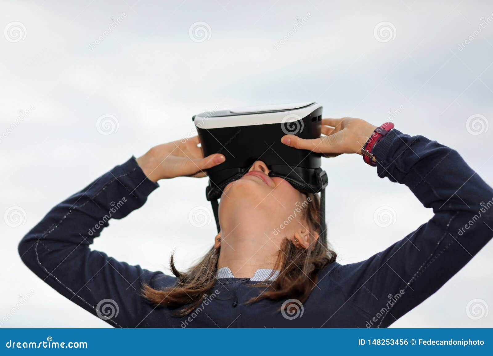 little girl plays with modern vr visor