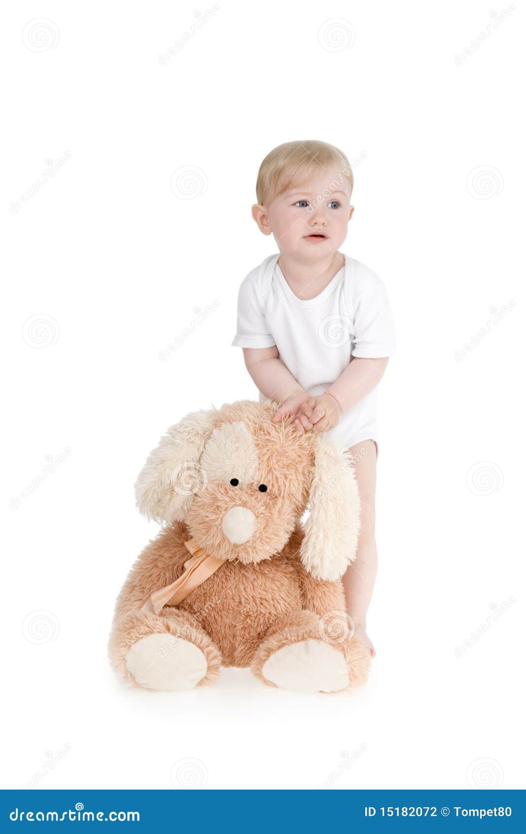 Little girl with plushy dog on white background.