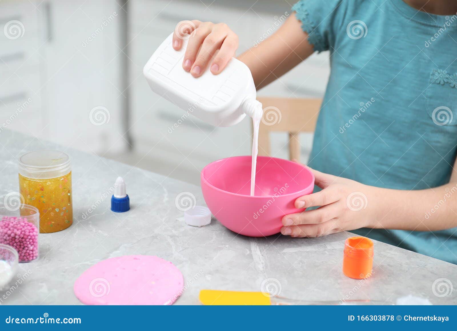 Little Girl Pouring Glue into Bowl at Table in Kitchen. DIY Slime Toy Stock  Photo - Image of fluffy, person: 166303878