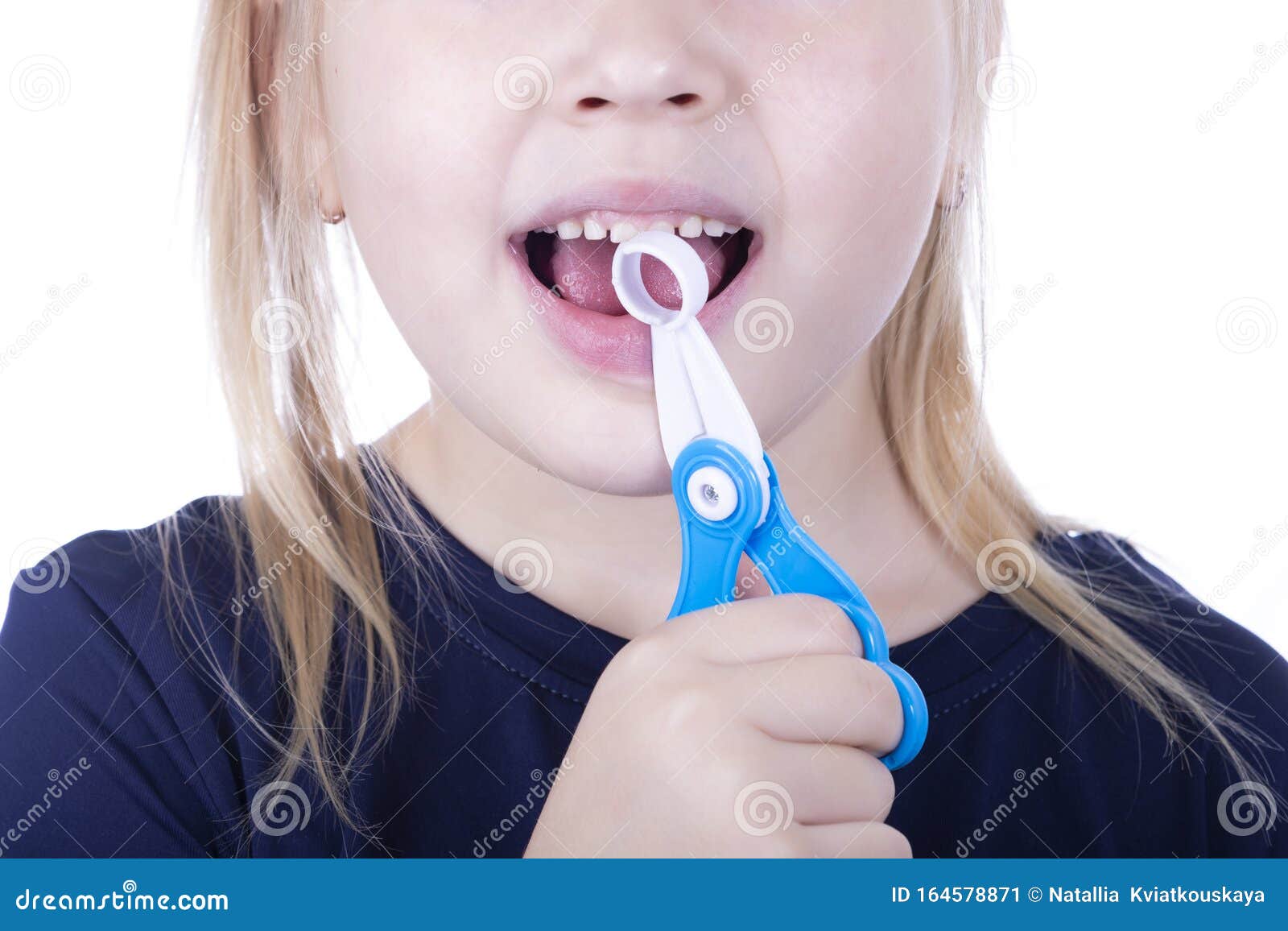 Little Girl Pull Out A Tooth With Toy Pliers On A White