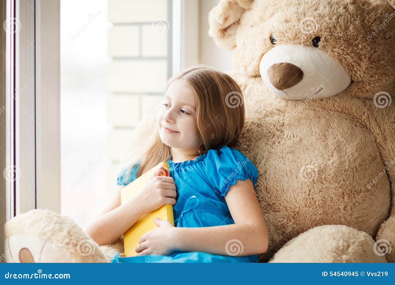 Little Girl Reading on Windowsill with Big Toy Stock Image - Image of ...