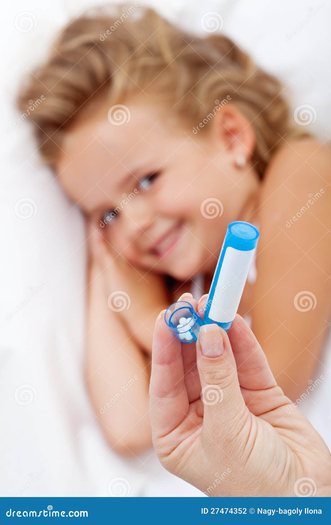 little girl receiving homeopathic medication